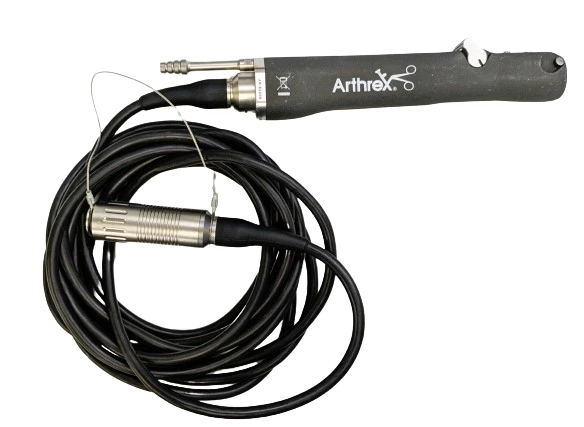 A dark powered handpiece with a short metal attachment at one end and a coiled electrical cable.