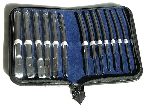 A case contains a row of smooth metal rods with rounded tips in progressively changing diameters.